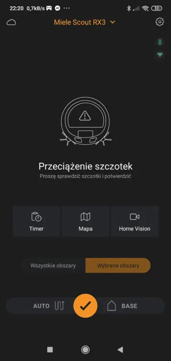 Ekran aplikacji Miele Scout z komunikatem Przeciążenie szczotek, proszę sprawdzić szczotki i potwierdzić
